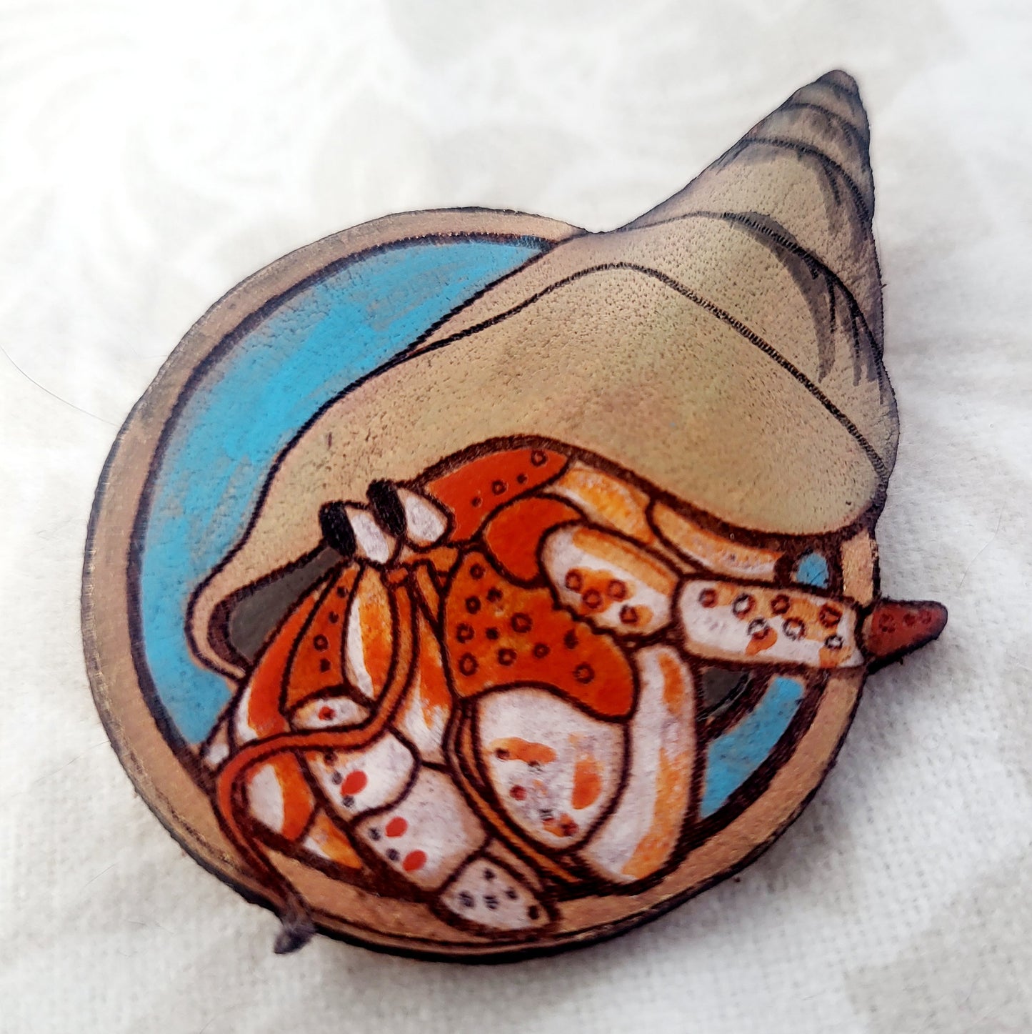 Hermit Crab on the Beach Leather Pin - July 2025 Limited Edition
