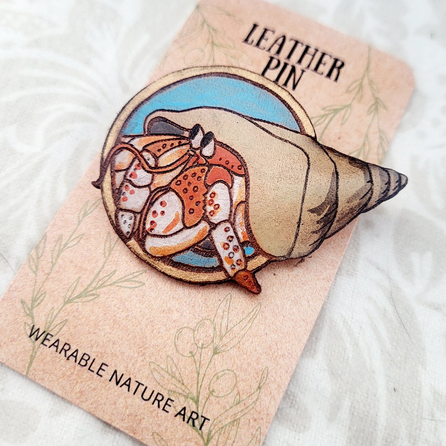 Hermit Crab on the Beach Leather Pin - July 2025 Limited Edition